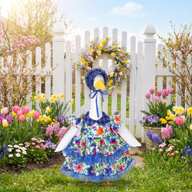 Abbylike porch-ready goose costume on lawn statue enhances outdoor charm.