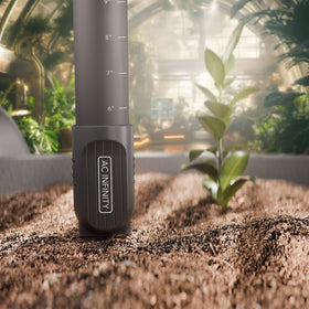 AC Infinity soil sensor monitoring moisture in a garden bed scene