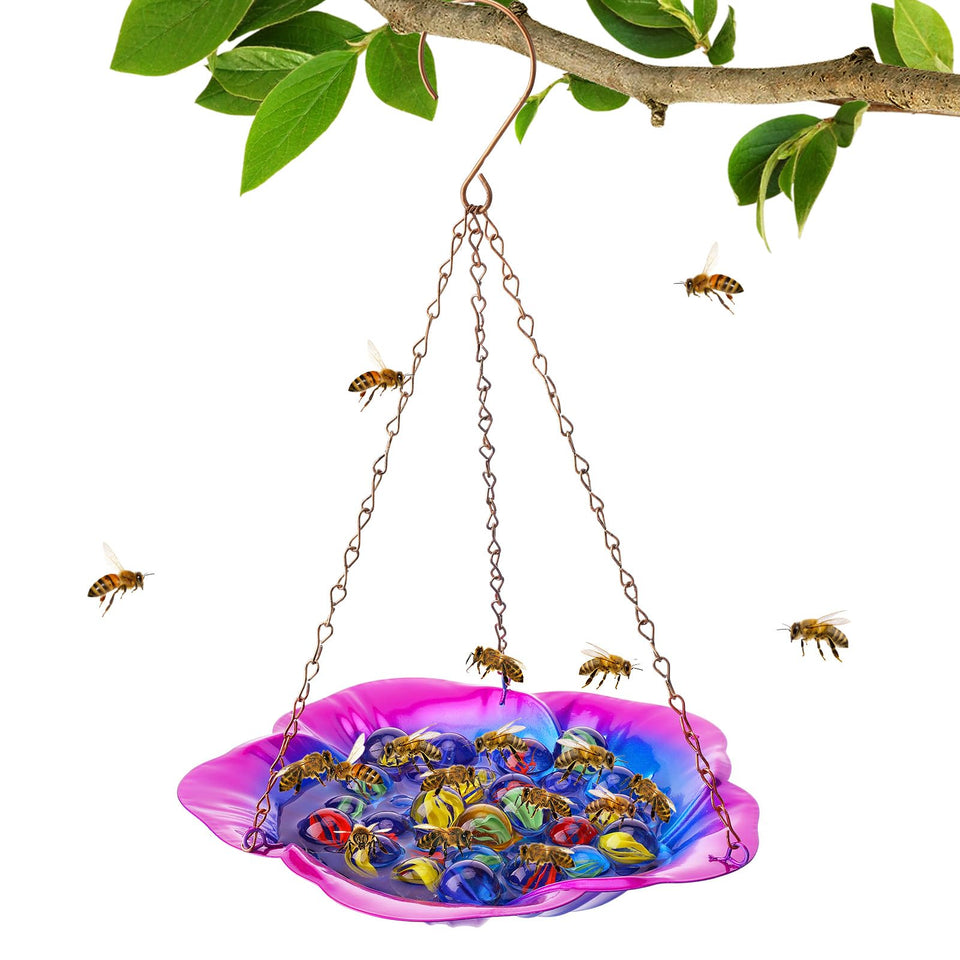 Acostop bee feeder with purple hibiscus design attracts pollinators in the garden.