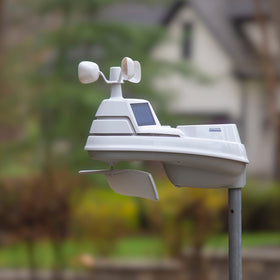 AcuRite Iris PRO+ outdoor installation showing secure wind direction and speed sensors.