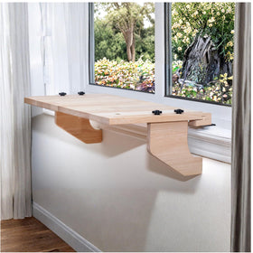 AD Furnishes SillMate window shelf displaying plants in sunlight.