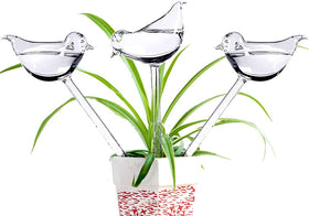 Adabocute glass bird-shaped watering globe keeps indoor plants moist while you're away.