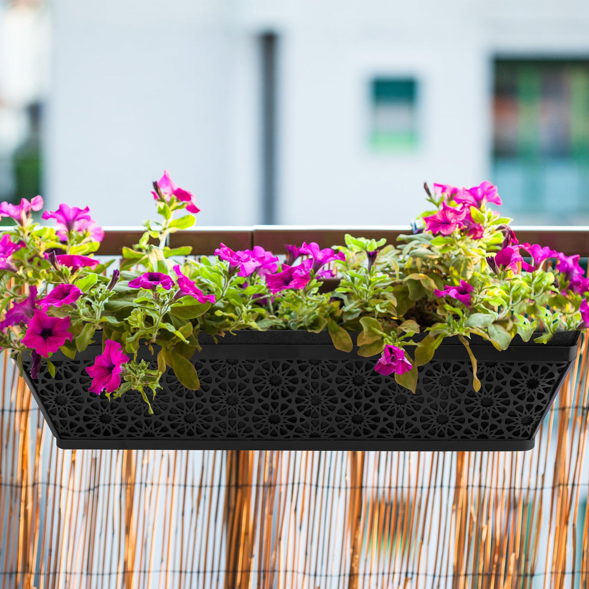 Adnee rectangle liner being inserted into a window box for easy setup.