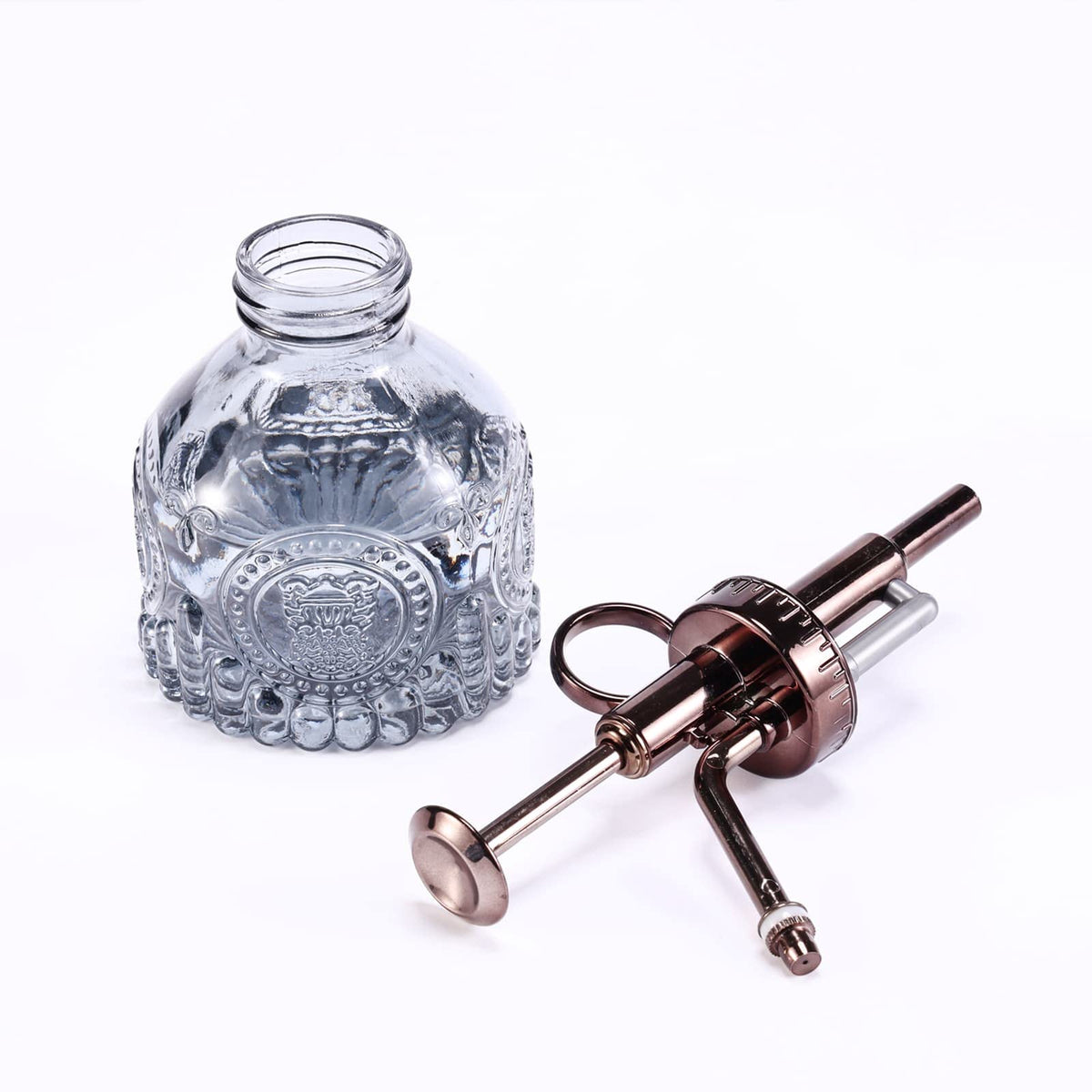 Aebor glass plant mister close-up reveals sturdy bronze pump and clear bottle