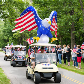AerWo golf cart parade decor adds festive flair.