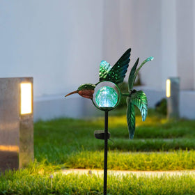 Afirst garden decor stake brightens driveways and borders