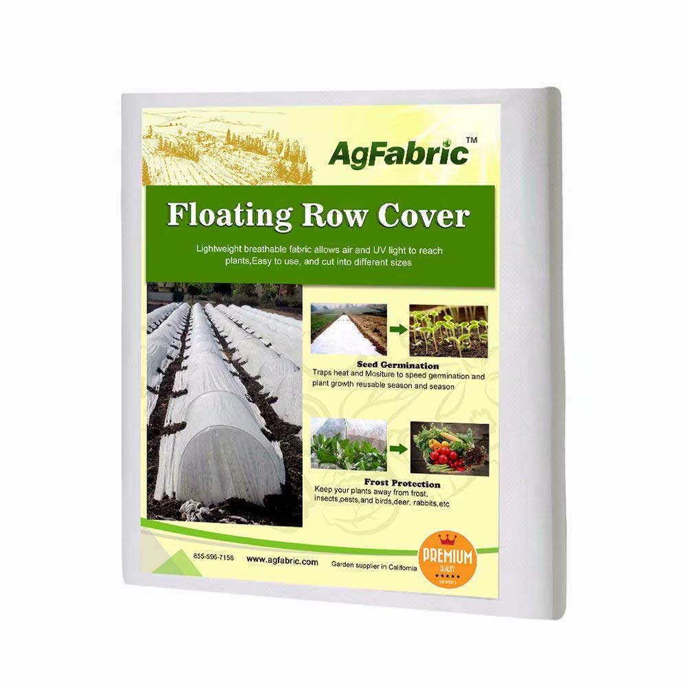 Agfabric freeze-protection row cover over garden bed allowing airflow and crop protection.