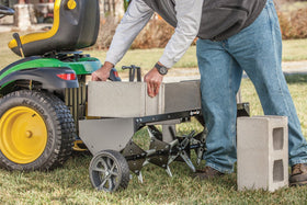 Agri-Fab aerator in use on a lawn during aeration