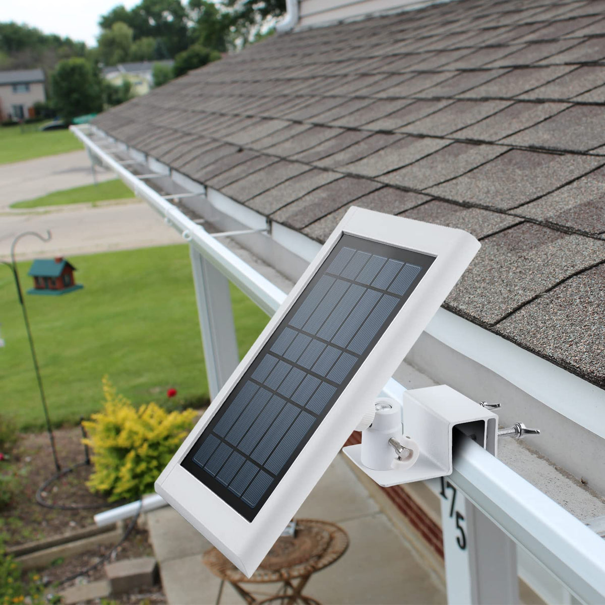 White finished bracket blends with gutters while supporting Ring solar panels outdoors.