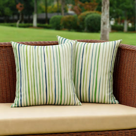 All Smiles spring outdoor pillow cover with sage-green stripes for patio decor