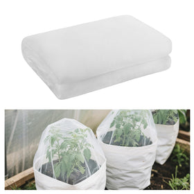 Alphatool garden netting spread over a bed protects crops while allowing light.
