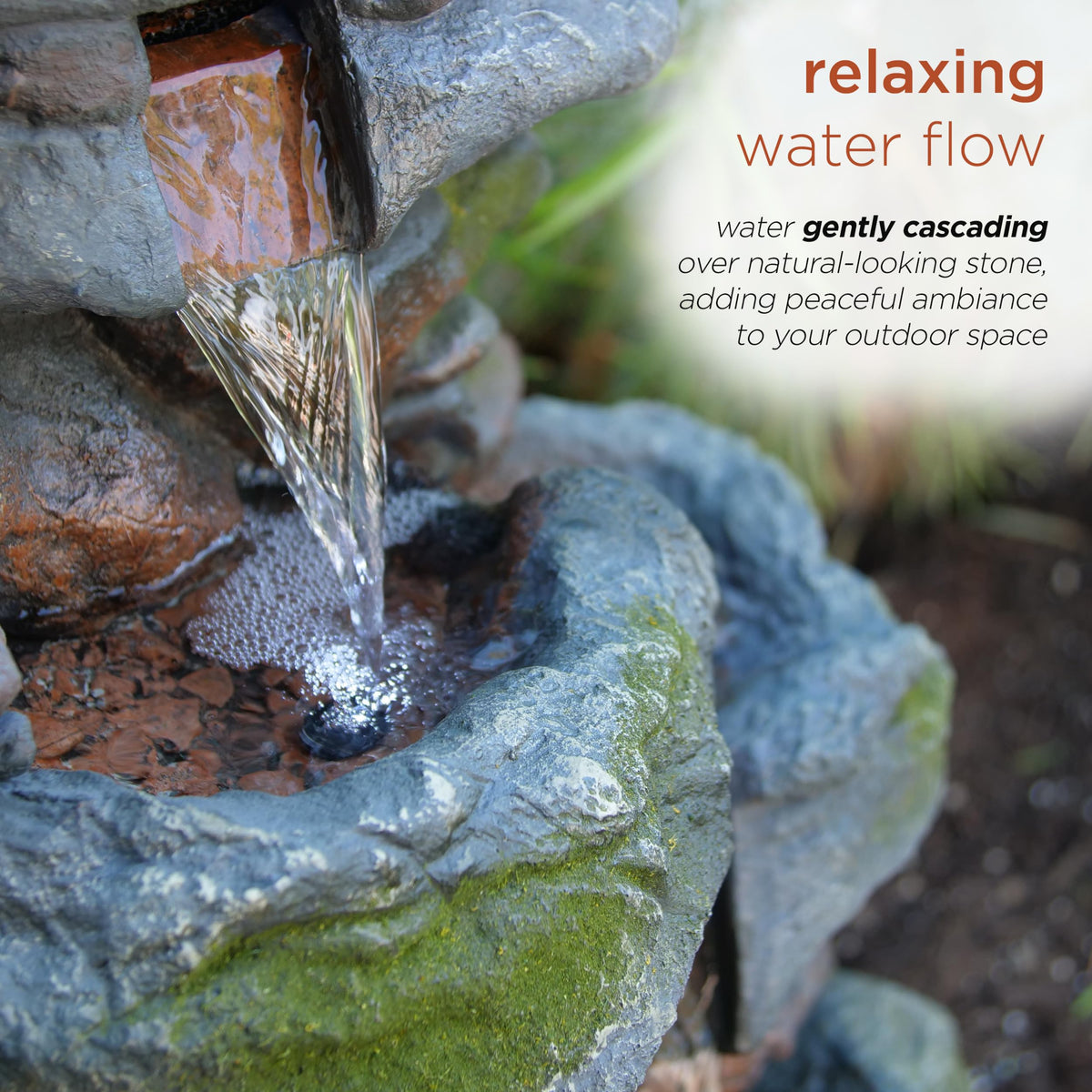 Alpine fountain stone-detail close-up with moss-like accents