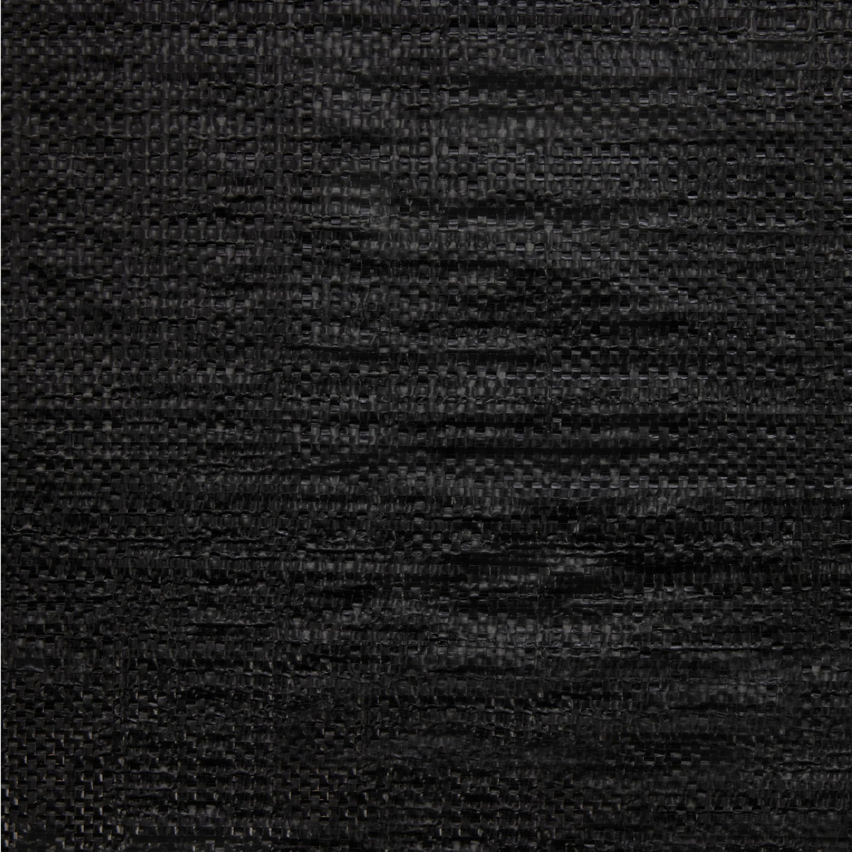 Amazon Basics 90 GSM polypropylene mat seen during installation under gravel for durability.