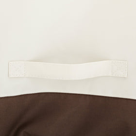 Amazon Basics chair cover uses click-close straps for wind-resistant stability.