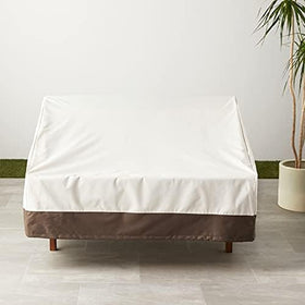 Amazon Basics cover with click-close straps securing the sofa cover on a windy day.