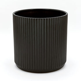 Amazon Basics fluted ceramic round planter showing elegant surface texture.