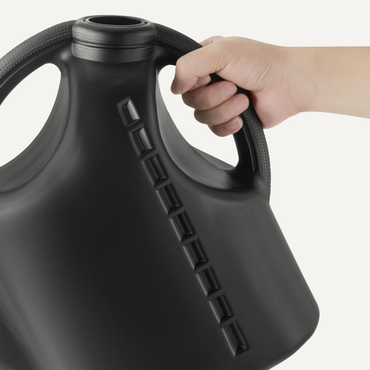 Amazon Basics Watering Can features a large opening for quick refills from a spigot.