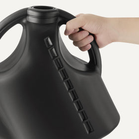Amazon Basics Watering Can features a large opening for quick refills from a spigot.