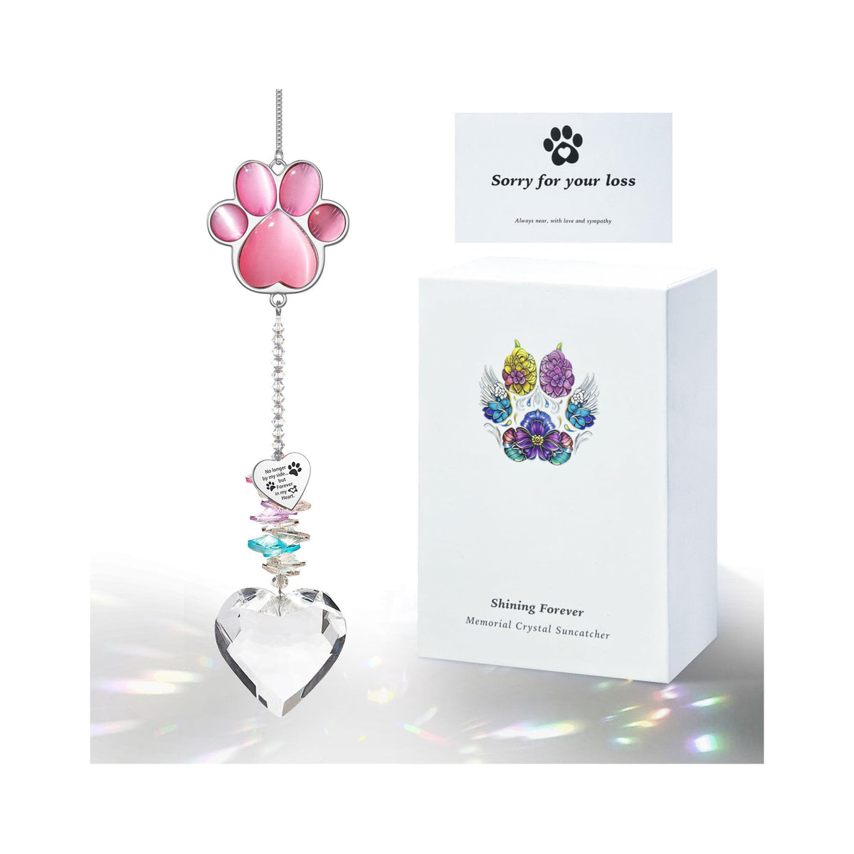 AMETHUARTZ Pet Memorial paw crystal pendant catches sunlight to cast rainbow colors.