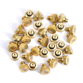 Aootech brass misting nozzle in landscaping setup providing gentle mist for plants.