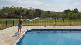 Swimmer using Aqua Clear Pool Shock for clean pool water.