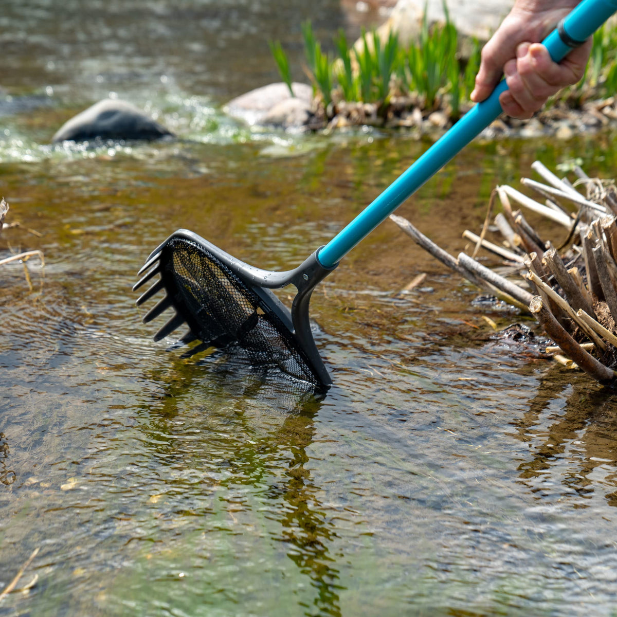 Aquascape Pond Shark Net fine mesh captures leaves while protecting pond fish.