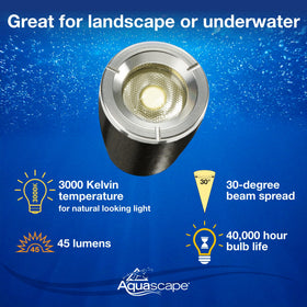 Aquascape spotlight mounted on stone edging for garden lighting.