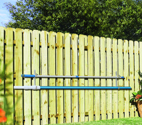 Aquatix Pro hanger mounted on fence keeps pool gear accessible.