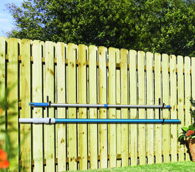 Aquatix Pro pool pole hanger installed on fence keeps gear within reach