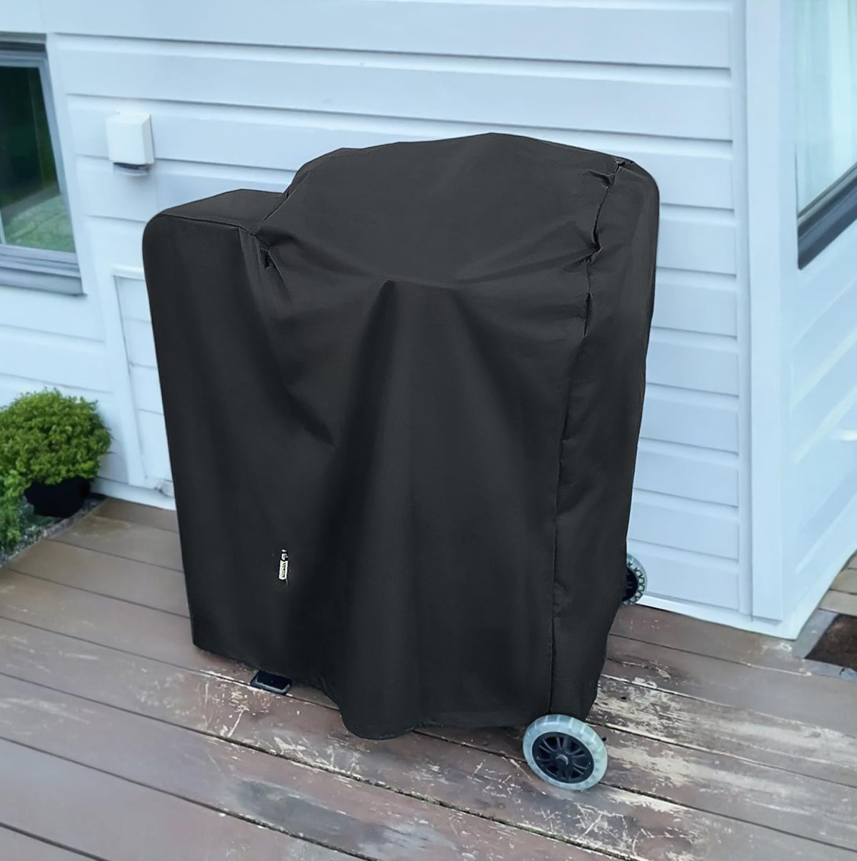 Arcedo grill cover with drawstring keeps grill secure during storms.