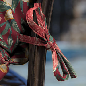 Arden Selections cushion displayed on a dining chair outdoors