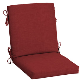 Arden Selections Ruby Red Leala cushion on an outdoor chair for al fresco dining.