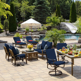 Arden Selections pillow on a chair demonstrating outdoor comfort
