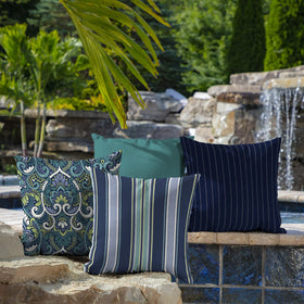 Two-pack Arden Selections pillows styled on a patio area