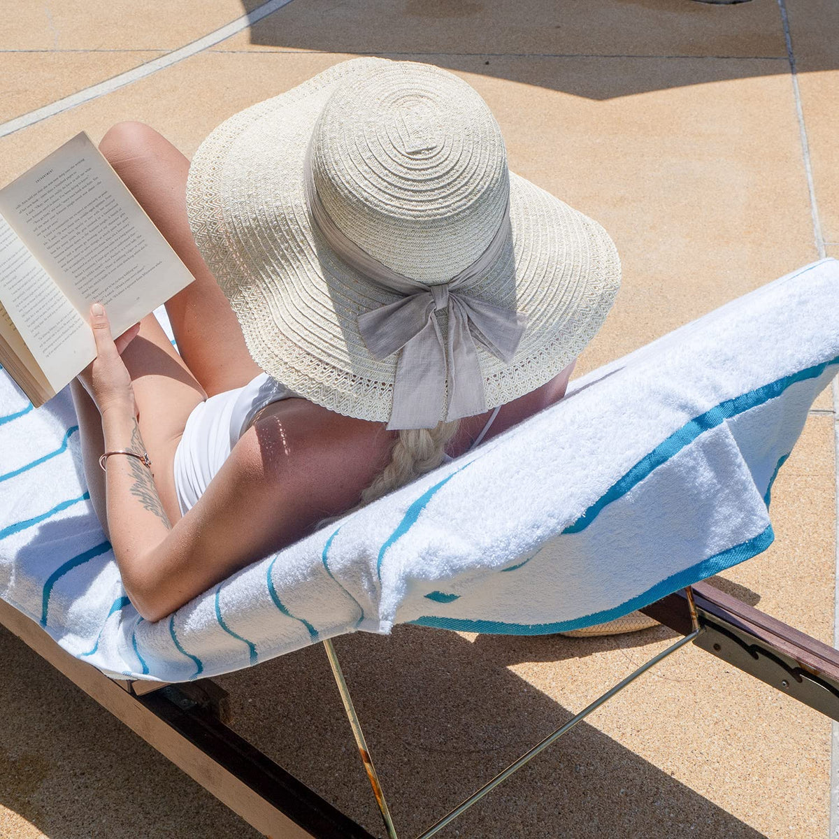Arkwright Las Rayas lounge cover by the pool emphasizes quick-dry, absorbent cotton.