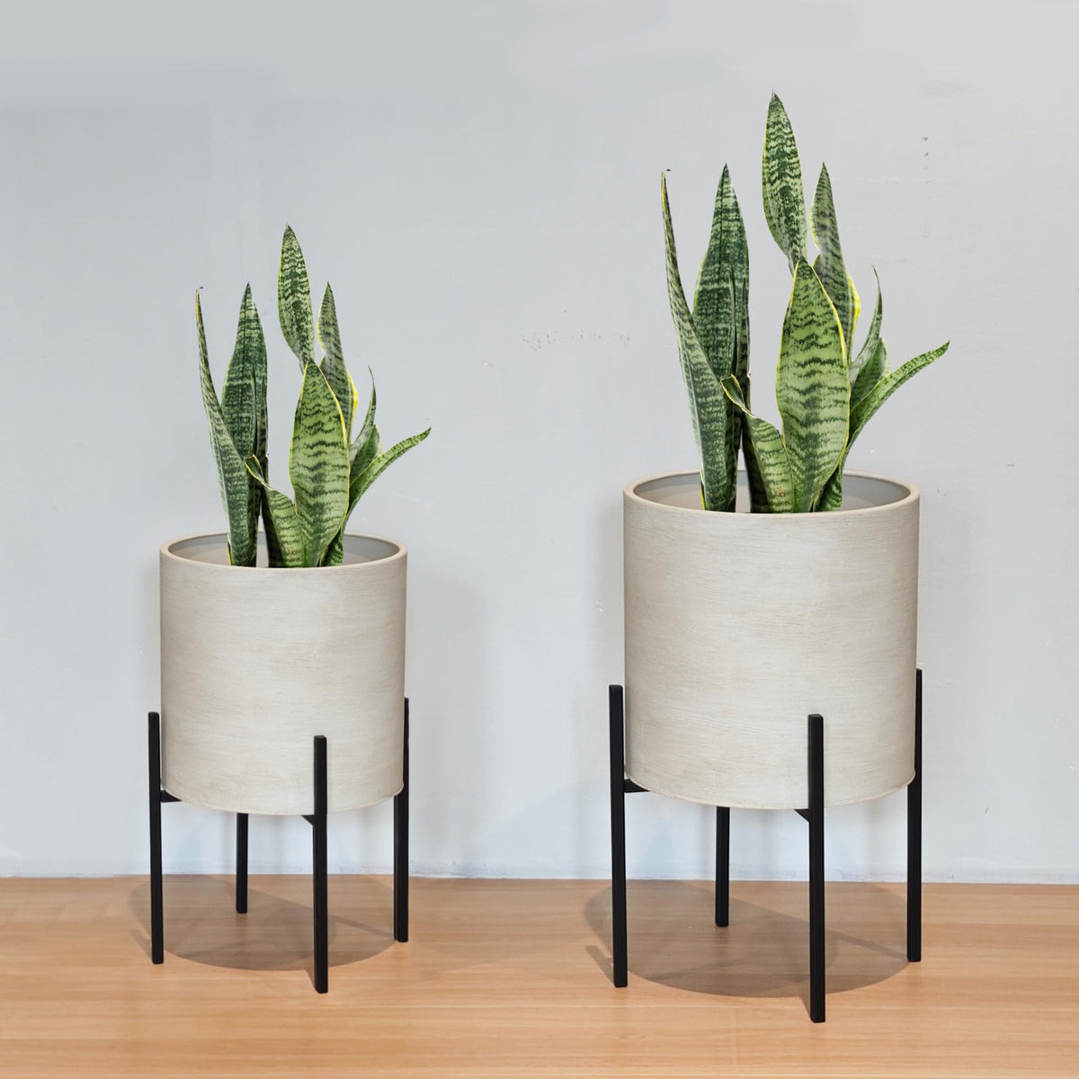 ARNIS dirt-color metal planters enhance plant color and textures.