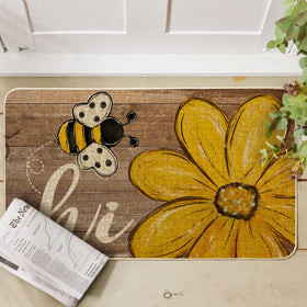 Artoid Mode Bee Daisy Hi Spring Doormat on porch showing sturdy non-slip backing