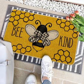Bee Kind Bow Tie Yellow Spring Doormat shows non-slip rubber backing for stability.
