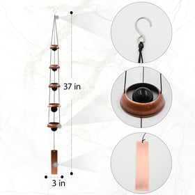 Askhald copper bell chimes shimmering in sunlight with deep resonance