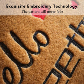 Assaoy embroidered front door mat with humorous text welcomes guests.