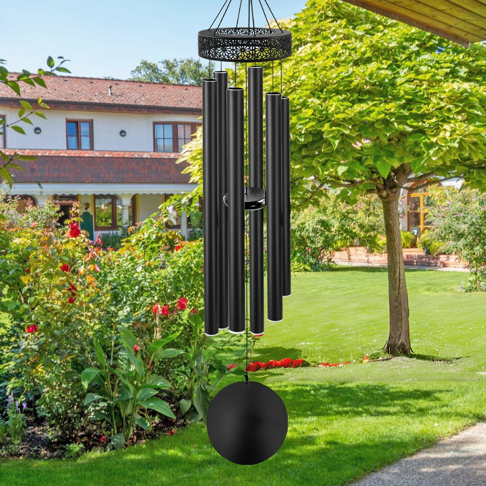 ASTARIN 48'' wind chimes outdoors showcasing deep tone for garden ambiance.