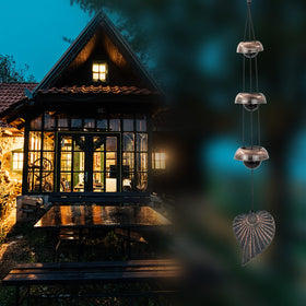 ASTARIN memorial wind chime in garden evokes peaceful remembrance.