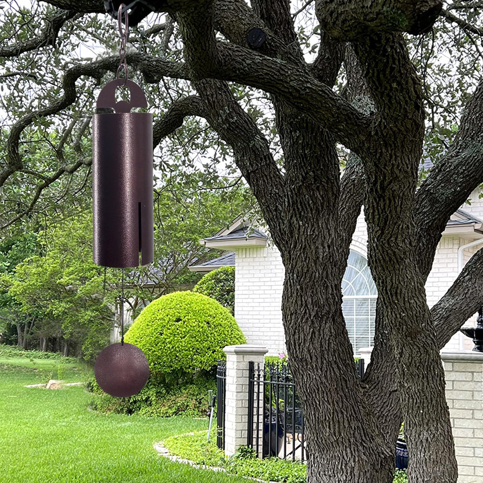 ASTARIN wind chimes outdoors in deep tone creating tranquil backyard ambience.