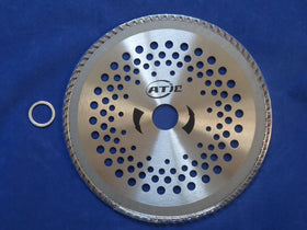ATIE carbide-tipped trimmer blade close-up showing welded tips for durability.