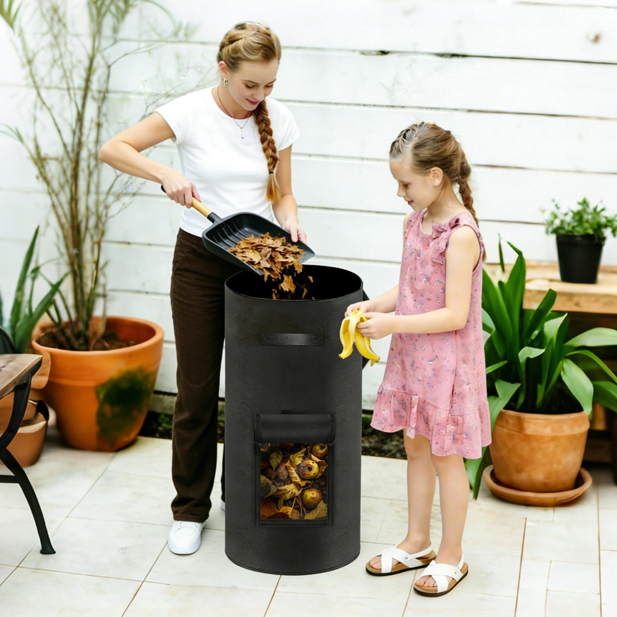 Atvkov garden-use compost bin converts scraps into garden-ready soil.