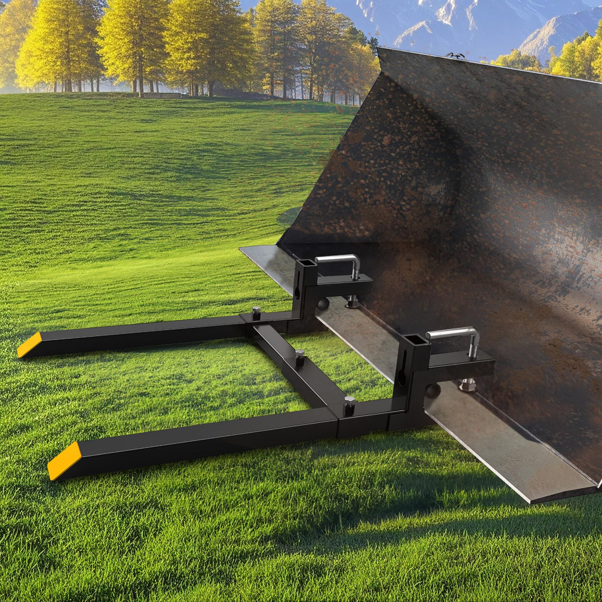 AUTOSAVER88 43-inch clamp-on pallet forks moving hay bales efficiently on site.