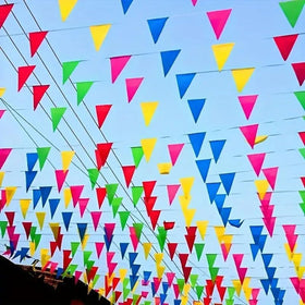 AUUEYY 260ft pennant banner with colorful triangles for vibrant venue decoration.