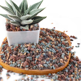 Avalution lava rock bag front showing drainage-friendly decorative gravel.