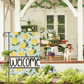 AVOIN colorlife Outdoor Welcome Flag displayed on a deck adds cheerful seasonal charm.