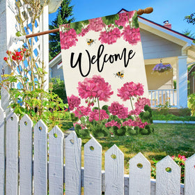 Close view of double-sided burlap flag with vibrant floral print
